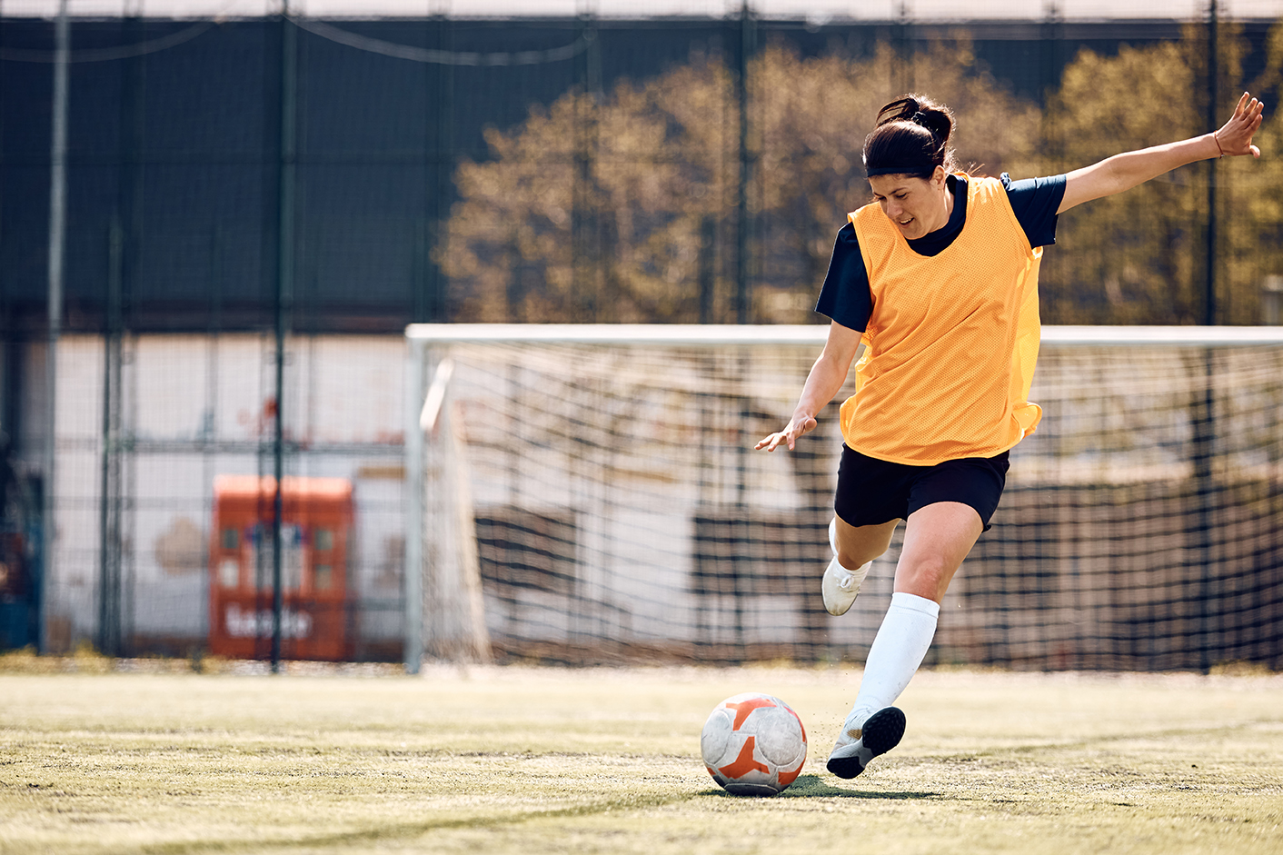 Woman Kicking Soccer ball